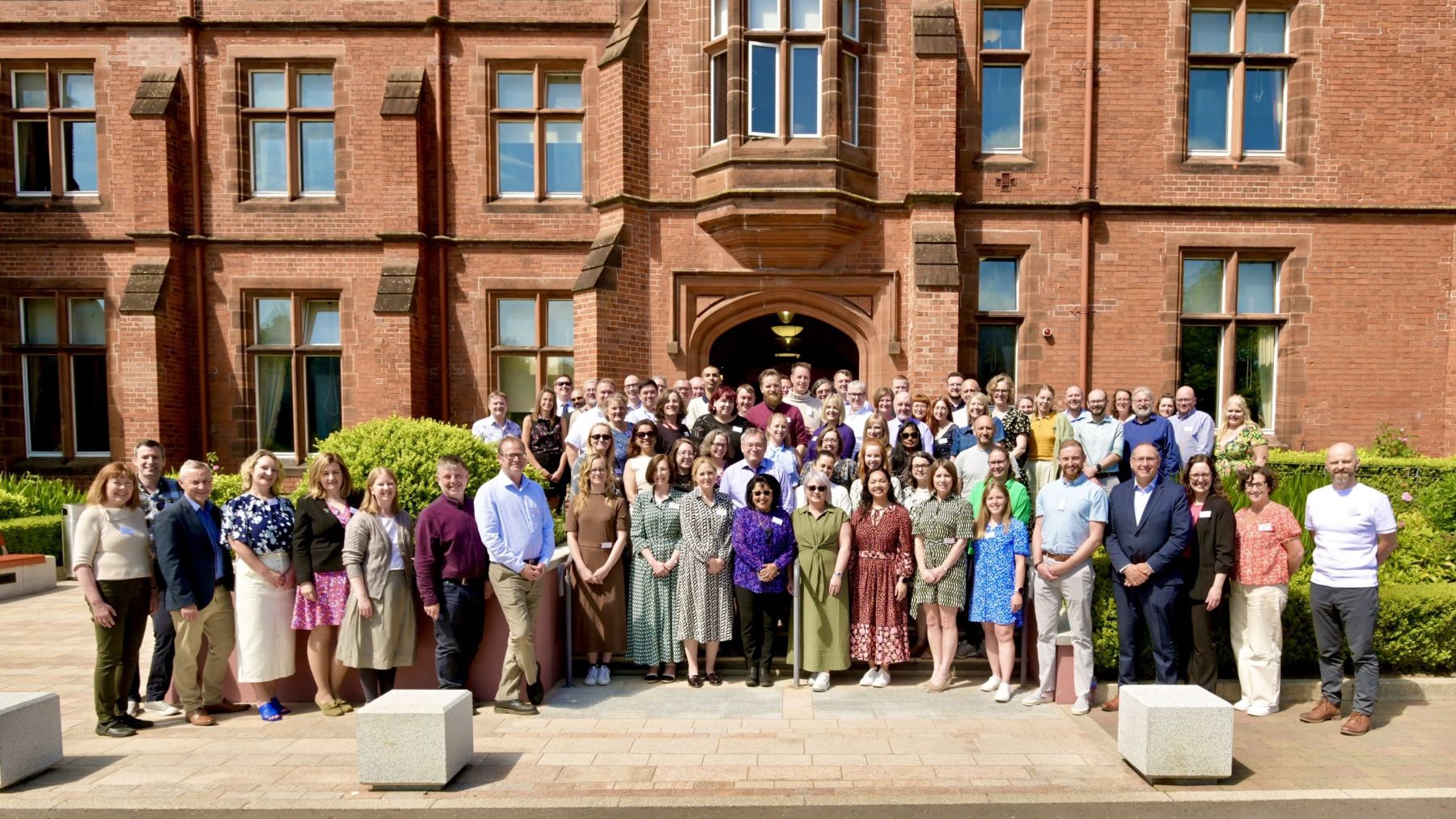 Delegates stand outside Riddel Hall