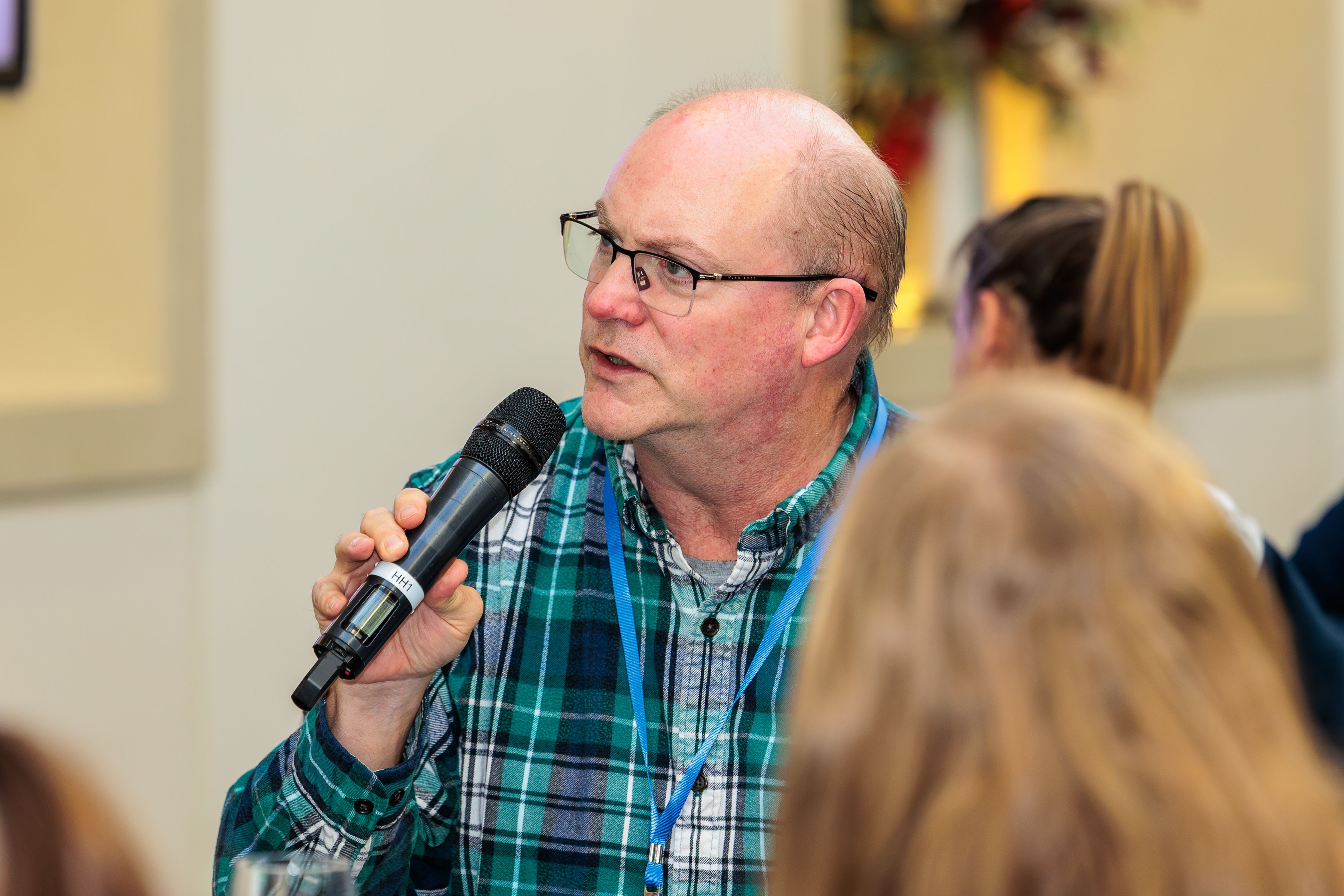 John Elvin, Industry Programme Manager at the Royal Society, spekaing into a microphone during a roundtable discussion