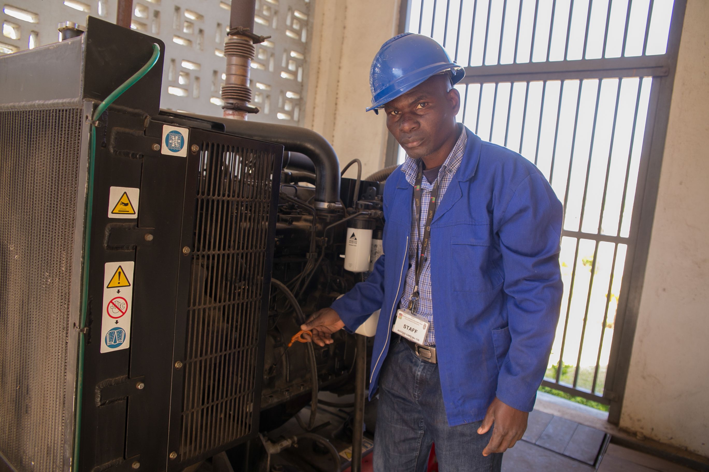 Wellcome Trust staff working with the equipment