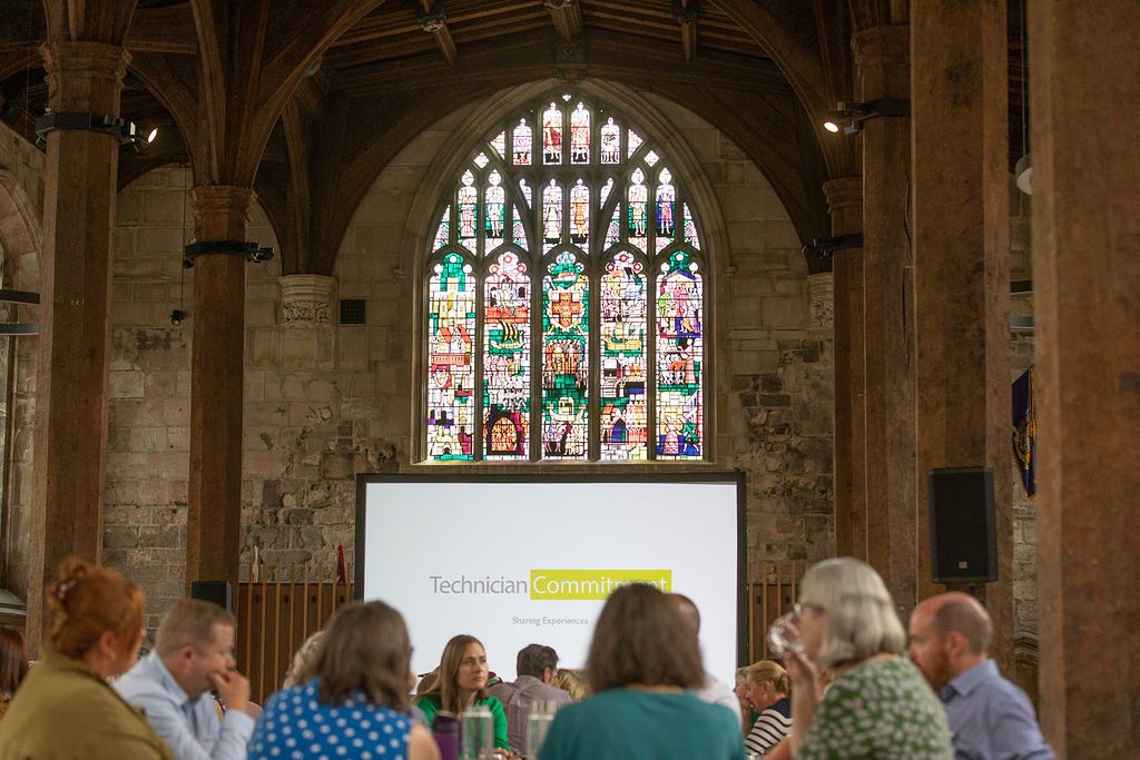 stained glass windows above main presentation podium