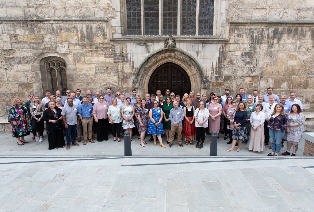 group photo outside the Hall