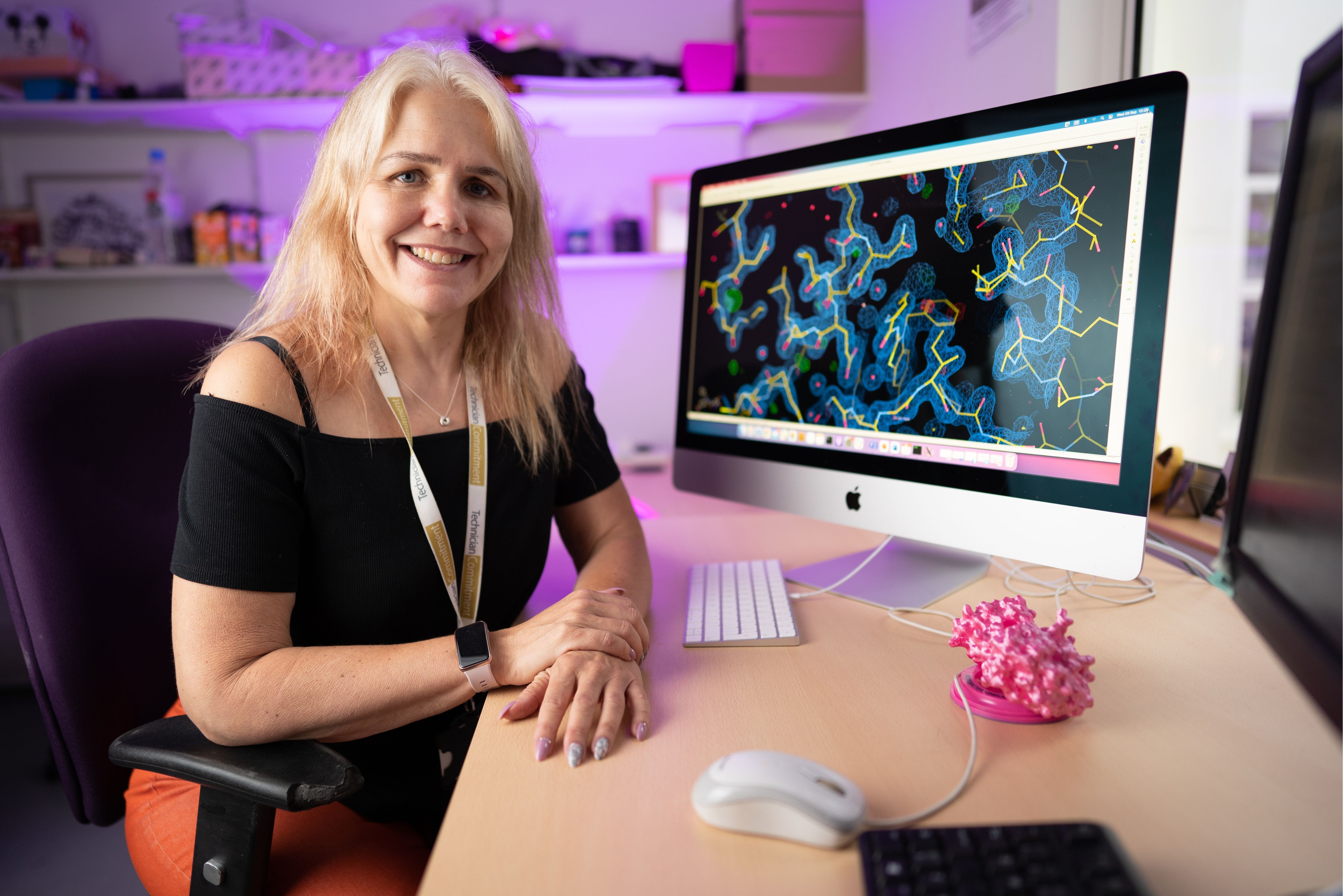 Clare Stevenson sat at a desk